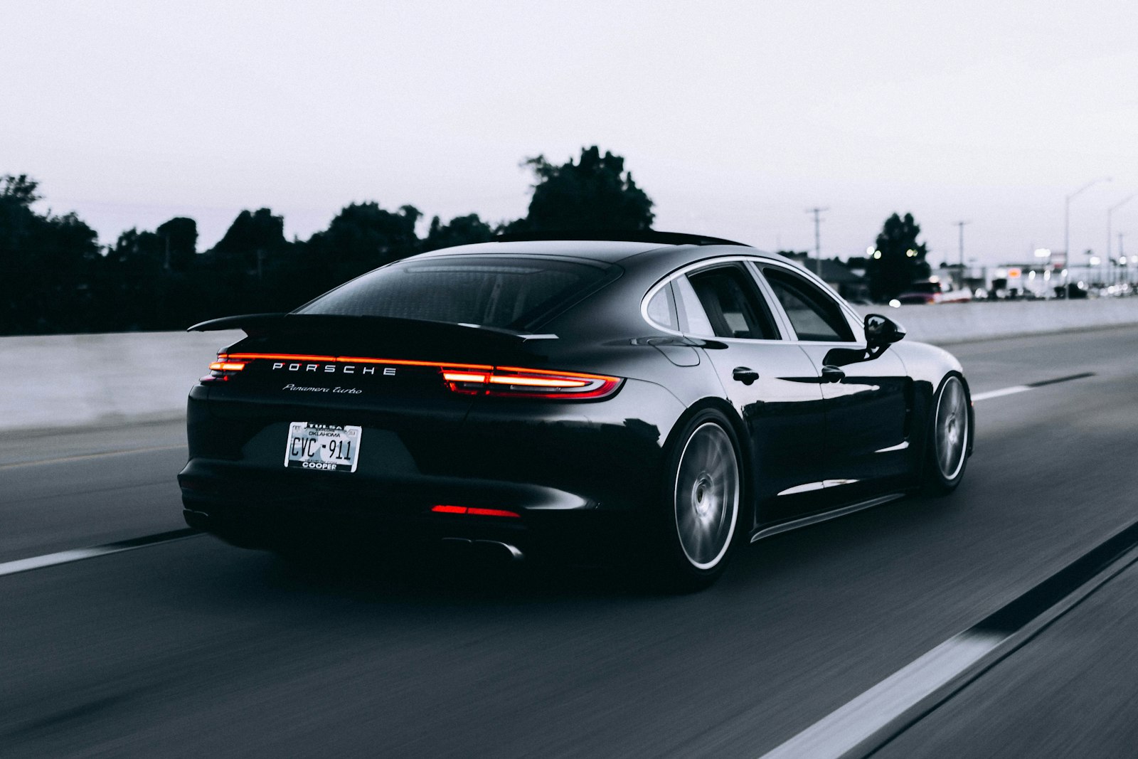 Mirror finish along the flank of a silver coupe